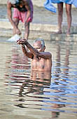 Varanasi - the ghats, the offer of Ganga Jal (holy water). 